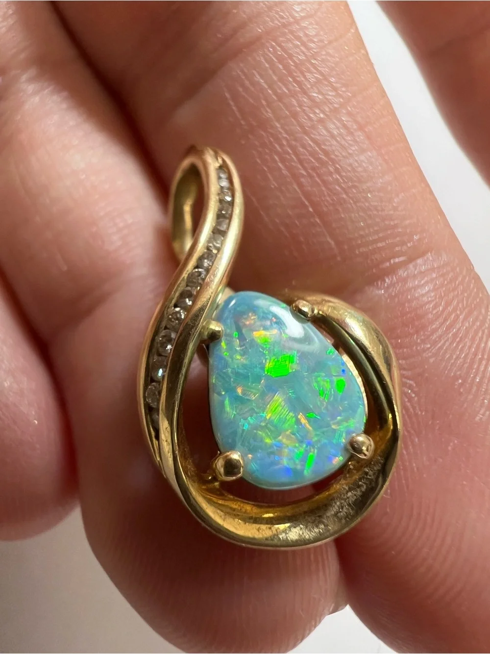 14K yellow gold pendant with genuine diamonds and an opal doublet